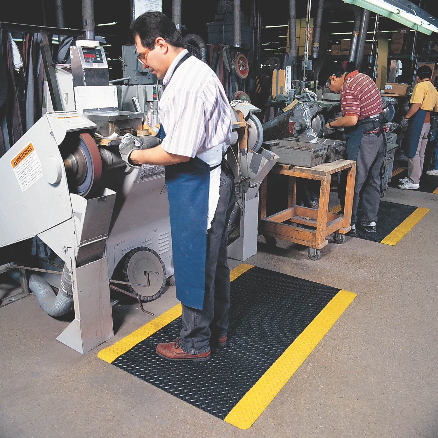Mata ergonomiczna Notrax, 479 Cushion Trax, laminowana, 122 cm x 22,8 m, obszar suchy, żółty/czarny
